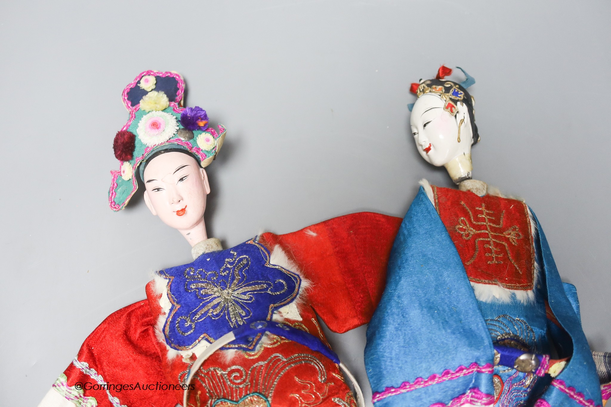 A pair of 20th century Chinese ceremonial dolls